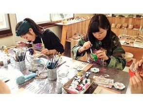 【沖縄・名護】カップルにおすすめ!陶器シーサー絵付け2匹【沖縄ドリンク付】の画像