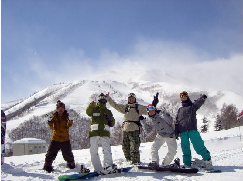 Men and women group enjoying snowboarding Magic Island