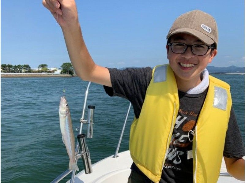 "Recreational Fishing Boat Junkie" Children enjoying fishing for flatfish