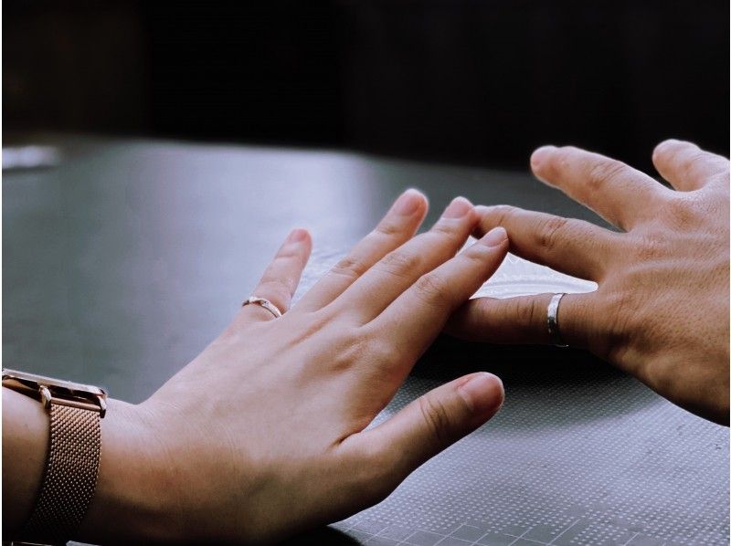 A couple enjoying the experience of making their own original rings at "dywf"