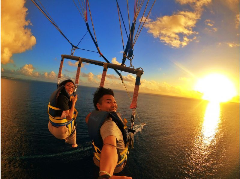 Couple enjoying parasailing Sea World