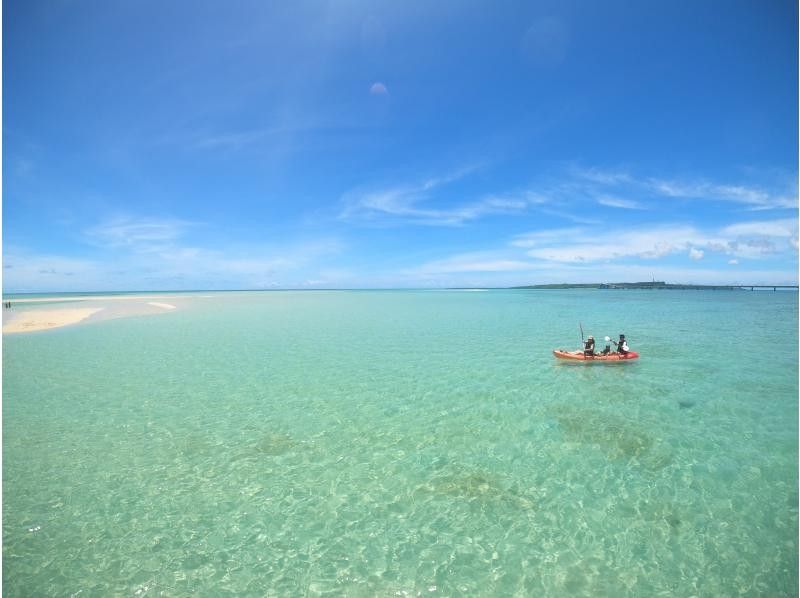 People enjoying kayaking on Miyakojima BLUE's phantom island (Uni-no-hama) landing tour