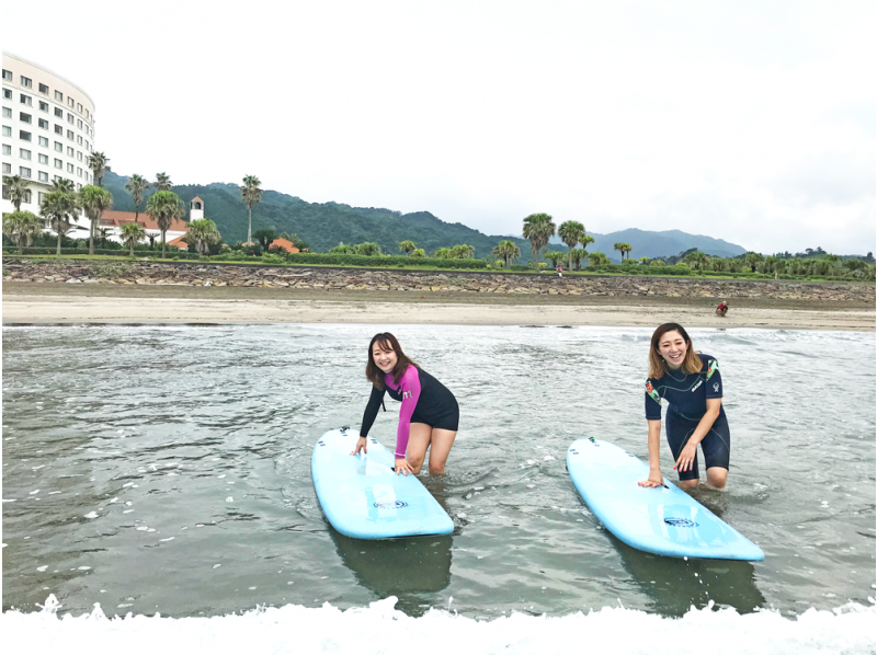 A woman enjoying a surfing experience at See u in the summer