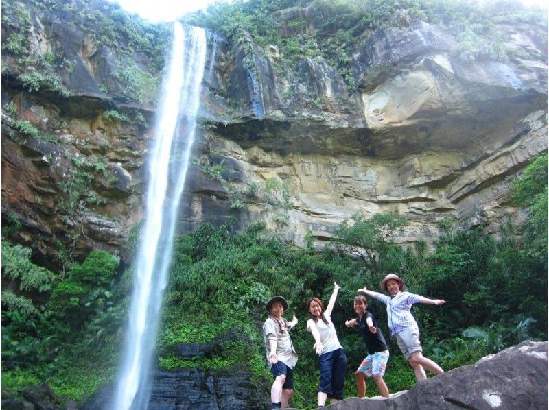 People participating in a trekking tour organized by "NilainaHolidays" on Iriomote Island in Okinawa