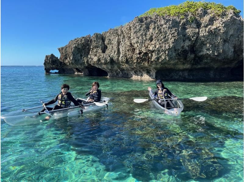 People enjoying clear kayak tour at Miyakojima Resort Sports