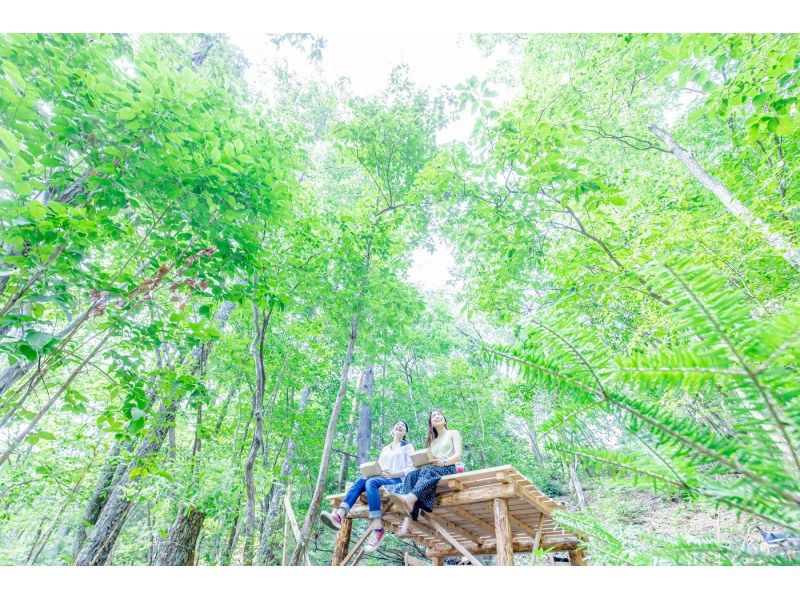 A woman enjoying a picnic at the Nantan City Miyama Tourism and Community Development Association