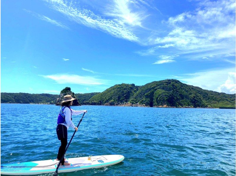 A woman enjoying SUP at SeaIzu SUP & Kayak, Shimoda, Shizuoka, Sotoura Beach