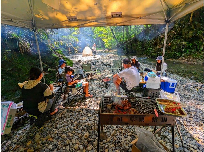 A family enjoying a day camp at Runofie in Akigawa Valley, Akiruno, Tokyo