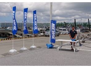 The reception area is marked by a blue banner that reads ``NEWS''.