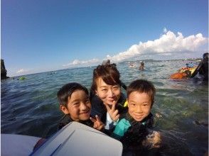 Parent and child snorkeling