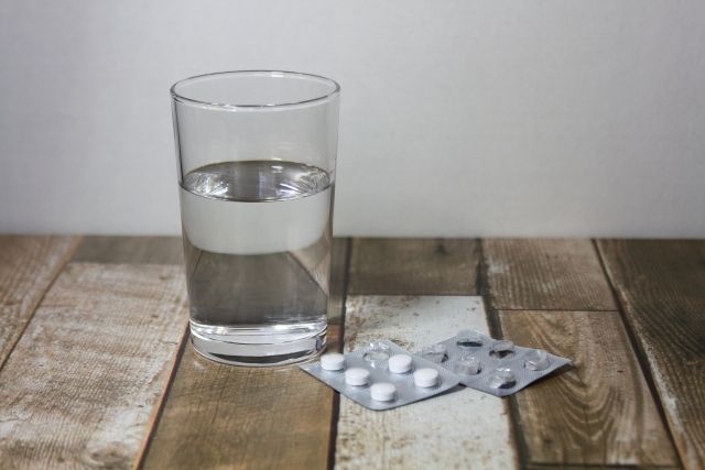 Glass of water and medicine Medicine pills