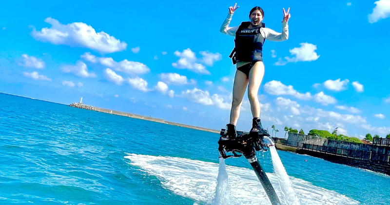 A summer paradise in Okinawa - woman riding a flyboard