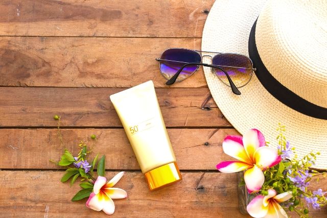 Sunscreen and sunglasses image