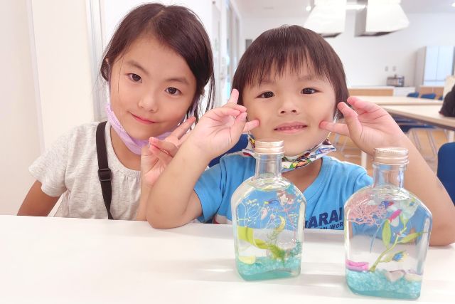 Children enjoying the herbarium experience at "+ism" in Chiba