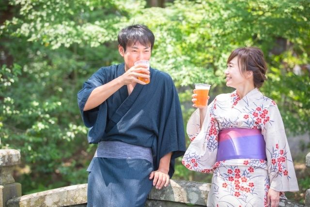 Couple drinking beer in yukata