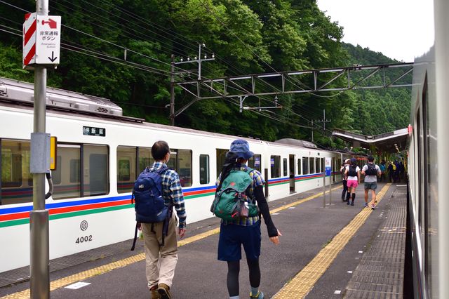 People heading off on a trekking trip from the Seibu Line station platform