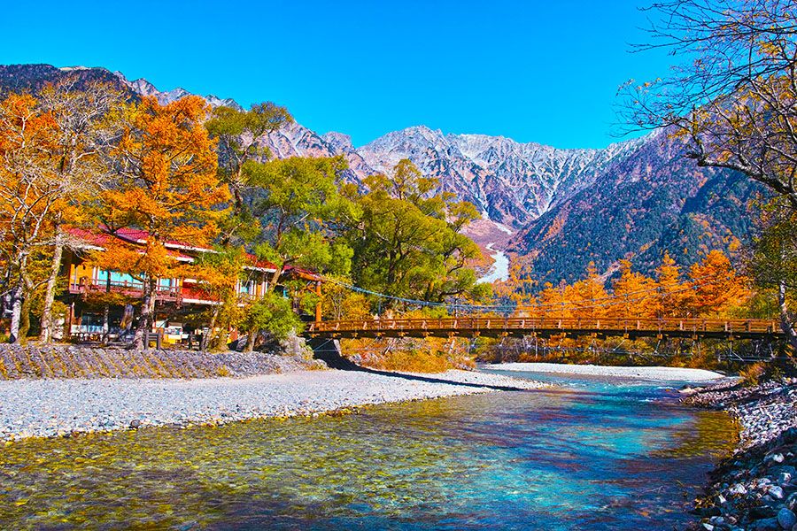 Nagano Autumn Sightseeing spot Kamikochi Kappa Bridge dyed in autumn leaves Azusa River Hotaka mountain range covered in snow Special scenic spot of the country Special natural monument