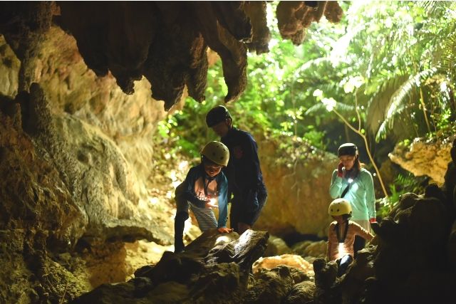 Summer Chama [Small group tour specialist] Families enjoying cave exploration at Kura Falls on Iriomote Island