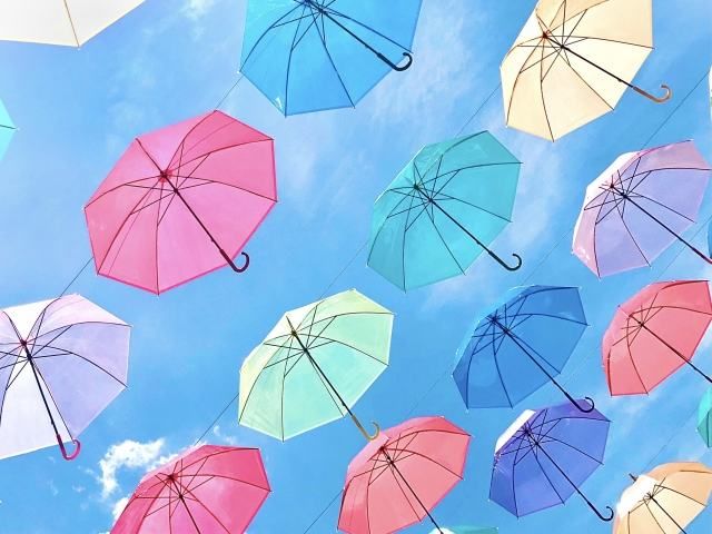 photo of umbrella and blue sky