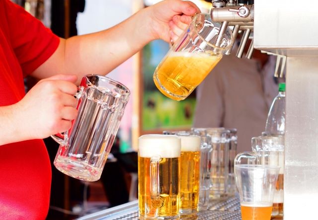 A picture of pouring draft beer into a beer mug