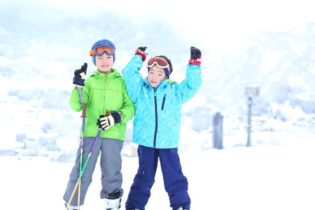 Children enjoying skiing Snow education Ski wear