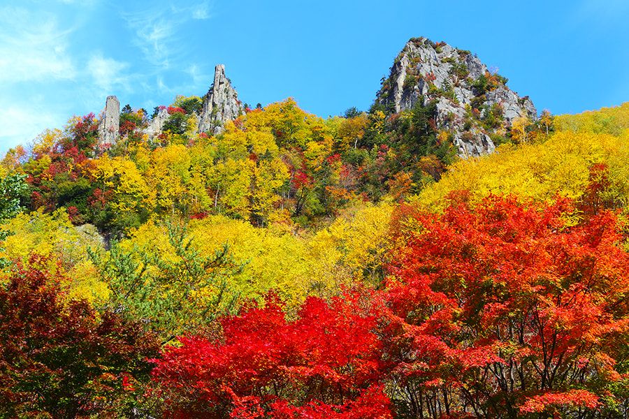 Hokkaido Sounkyo Columnar joints Beautiful valley area with rock faces and green trees Famous spot for autumn leaves Walking course Observation point Daisetsuzan National Park