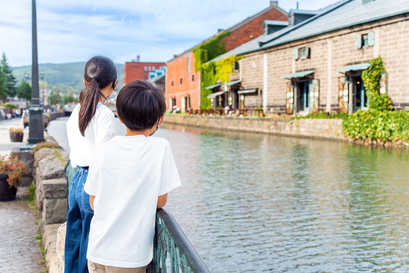 Brothers looking at the Otaru Canal, Hokkaido A popular place for families