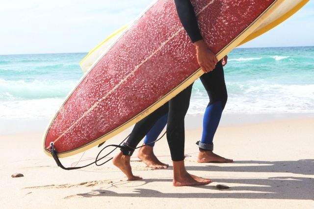 men and women enjoying surfing