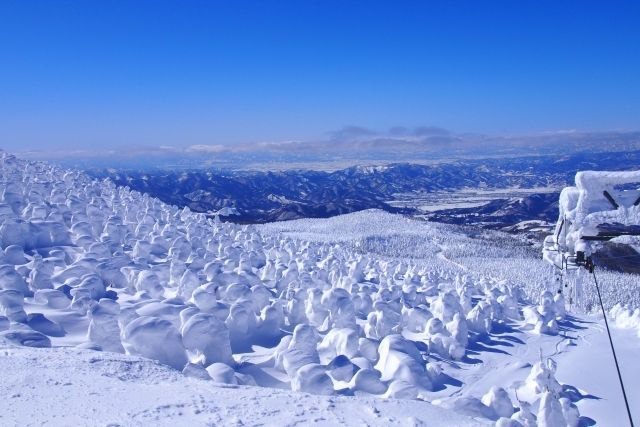 Winter in Yamagata, frost-covered trees and blue sky in Zao