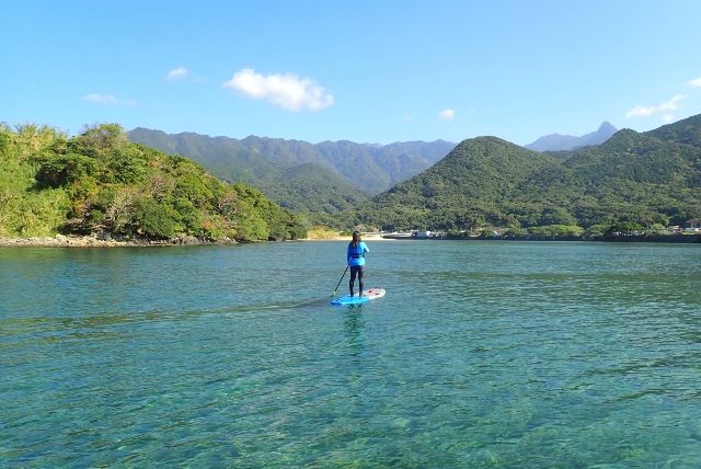 People enjoying a SUP experience at Yakushima Guide Club in Yakushima, Kagoshima